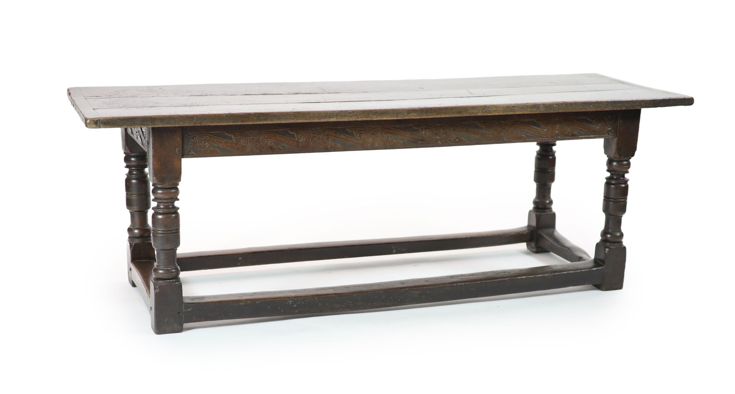 A Charles I oak refectory table, possibly West Country, having three-plank top H 74cm. W 220cm. D 76cm.